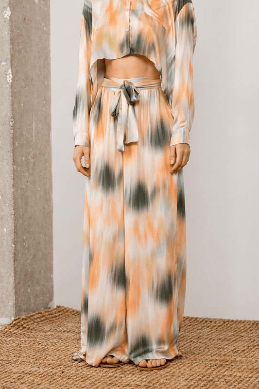 Printed Ecovero Viscose Wide-Leg Trousers in soft olive and seasonal print, offering relaxed elegance and movement.