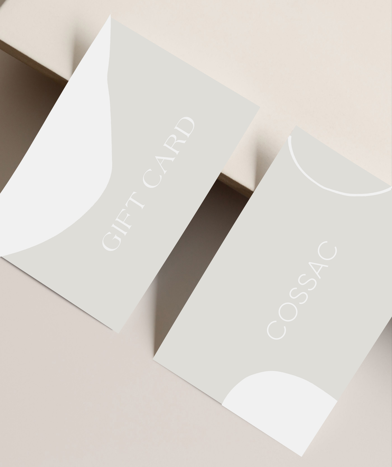 Two elegant gift cards displayed on a neutral background, featuring the text 'GIFT CARD' prominently.
