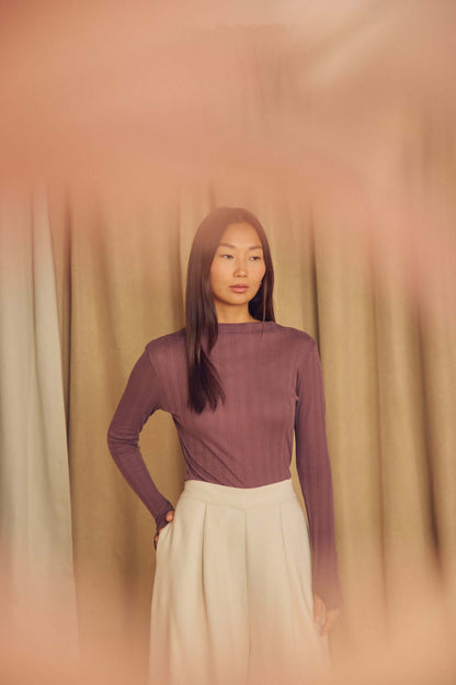 Cocoa Lyocell Ribbed Long Sleeve Top worn by a model, showcasing a refined, cocoa brown color with a soft fit.