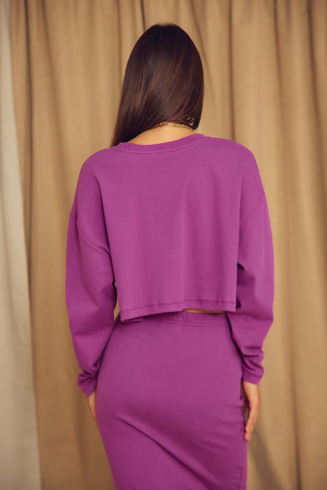 Plum Organic Cotton Oversized Crop Top displayed back view on model with long sleeves and cropped design.