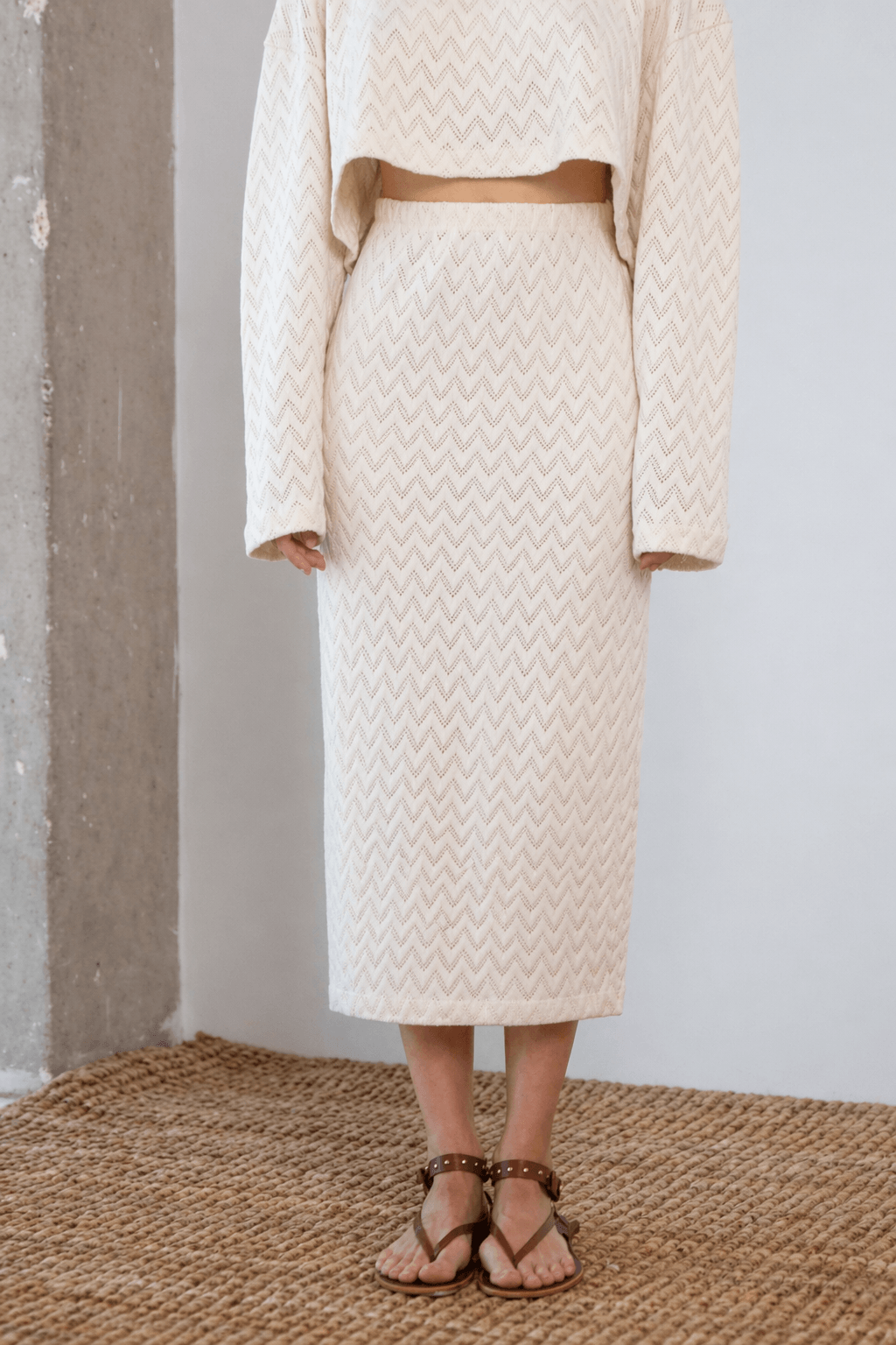 Crochet Organic Cotton Midi Skirt worn with a matching top, showcasing a textured design in ecru color.