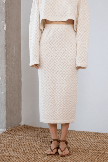 Crochet Organic Cotton Midi Skirt worn with a matching top, showcasing a textured design in ecru color.