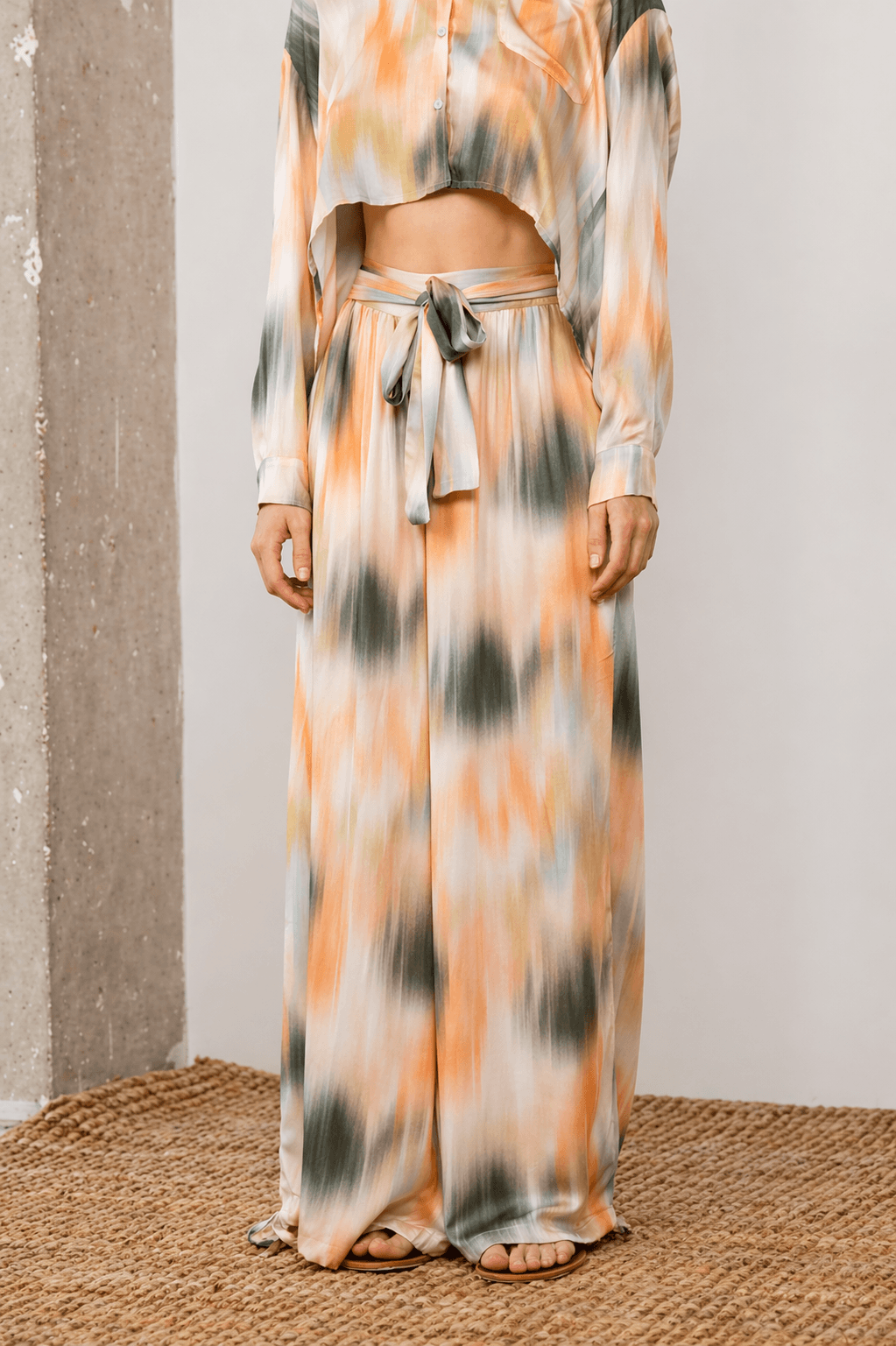 Printed Ecovero Viscose Wide-Leg Trousers in soft olive and seasonal print, offering relaxed elegance and movement.