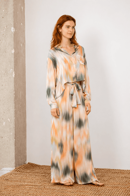 Model wearing Printed Ecovero Viscose Wide-Leg Trousers with a matching top in a soft print.