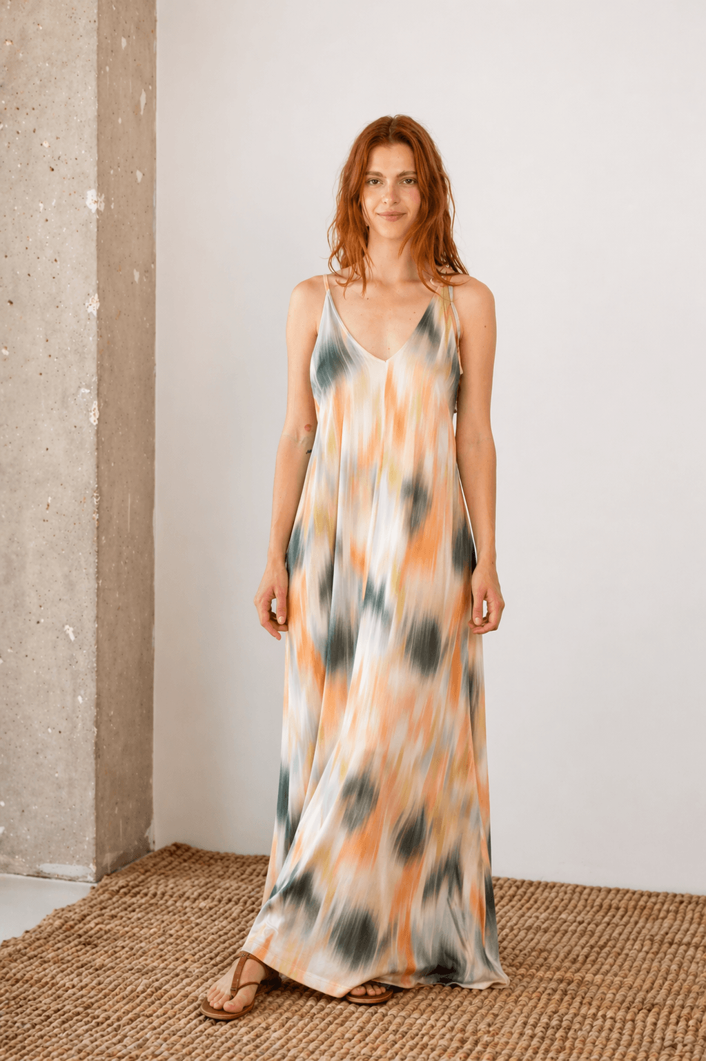 Model wearing Printed Ecovero Viscose Maxi Dress, showcasing its fluid design and seasonal print.