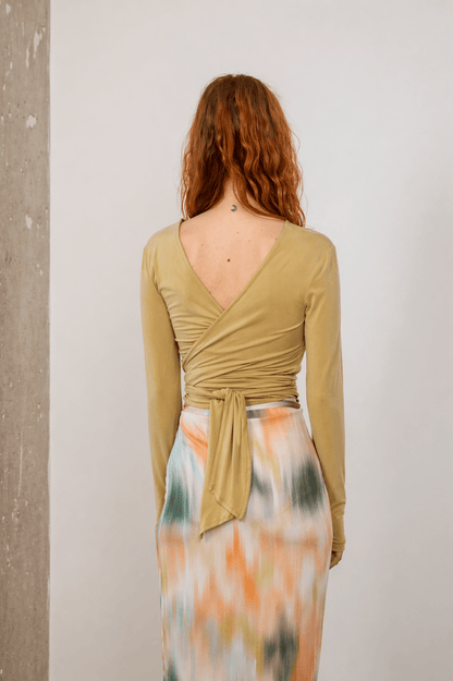 Cupro Multiway Wrap Top in Soft Olive showing the back design and flowy fabric.