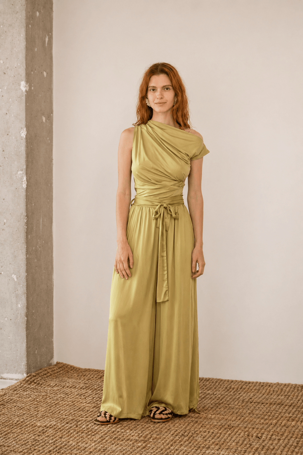 Wide Ecovero Trousers in Soft Olive showcased on a model, featuring a relaxed silhouette and detachable belt.