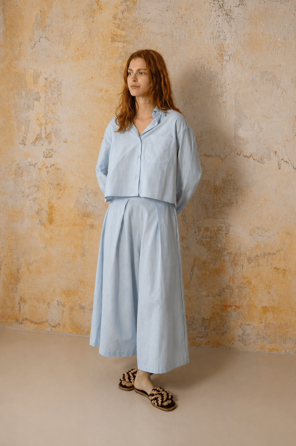 Model showcasing Organic Cotton Wide Culottes in Pale Blue, featuring a relaxed silhouette and cropped design.