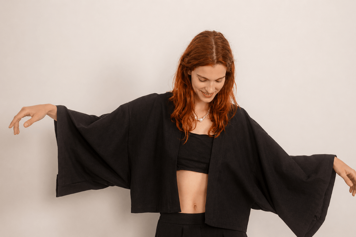 Organic Cotton Kimono Jacket in Black worn by model showcasing relaxed fit and oversized design.