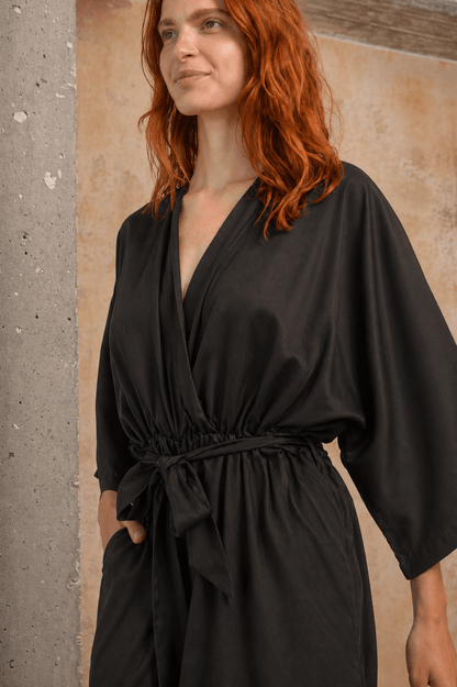Tencel Kimono Jumpsuit in Black worn by a model showcasing its elegant design and relaxed fit.