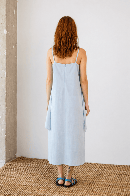 Organic Cotton Sun Dress with Front Frill in Pale Blue - back view showcasing relaxed silhouette and soft fabric.