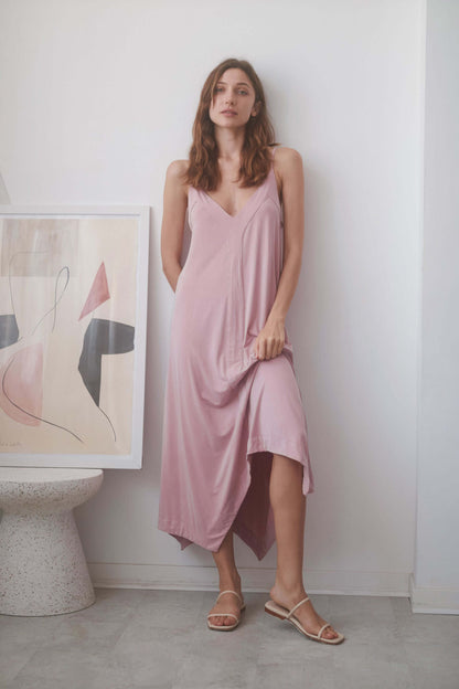 Model in ROSE CUPRO MIDI DRESS with adjustable straps and soft blush color, featuring a chic summer style.