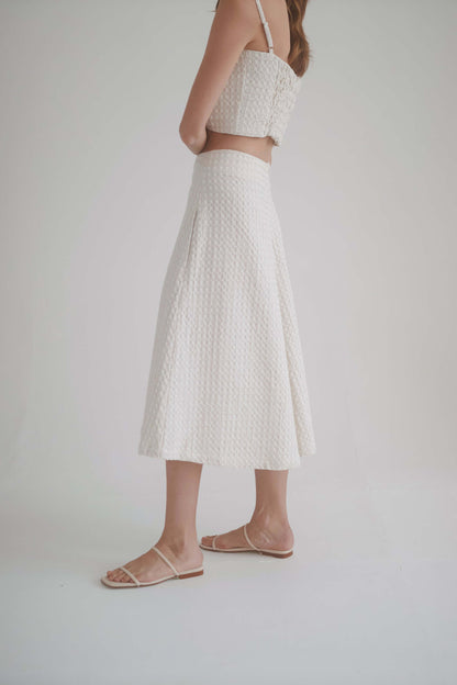 Model wearing ecru waffle culottes showcasing high waist and elegant A-line silhouette.