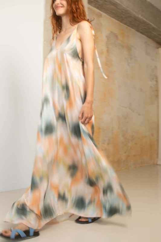 Model wearing a Printed Ecovero Viscose Maxi Dress, showcasing its fluid design and colorful print.