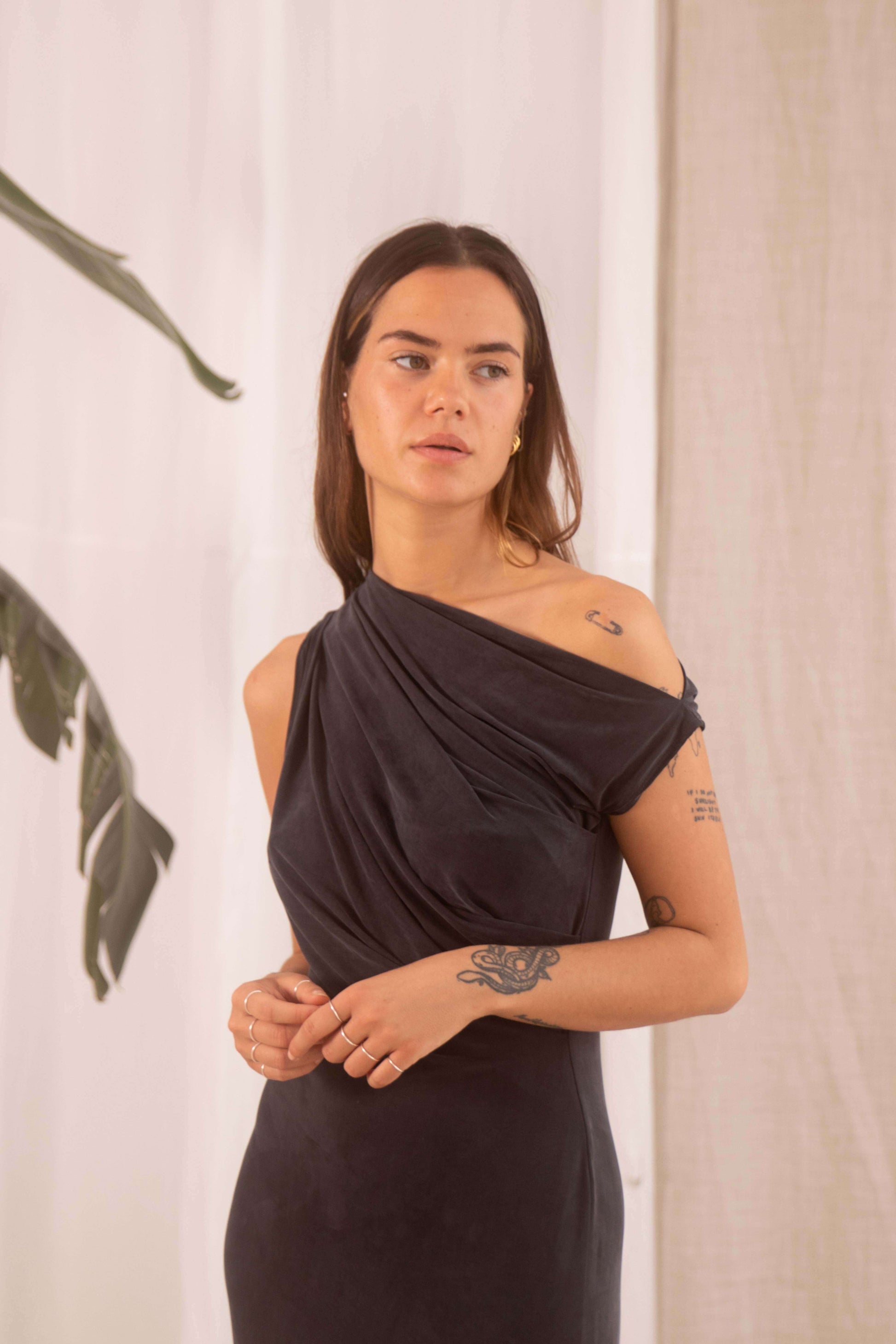 Model wearing Drape Cupro Midi Dress in Slate Black, showcasing draped neckline and fluid elegance.