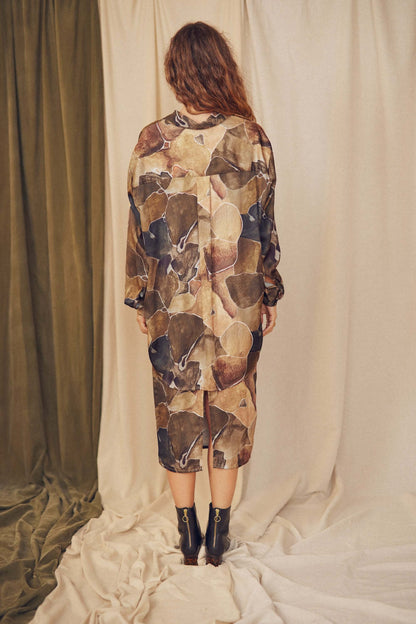 Back view of a model wearing a multicolour Printed Ecovero Pencil Midi Skirt, showcasing its eco-friendly design.