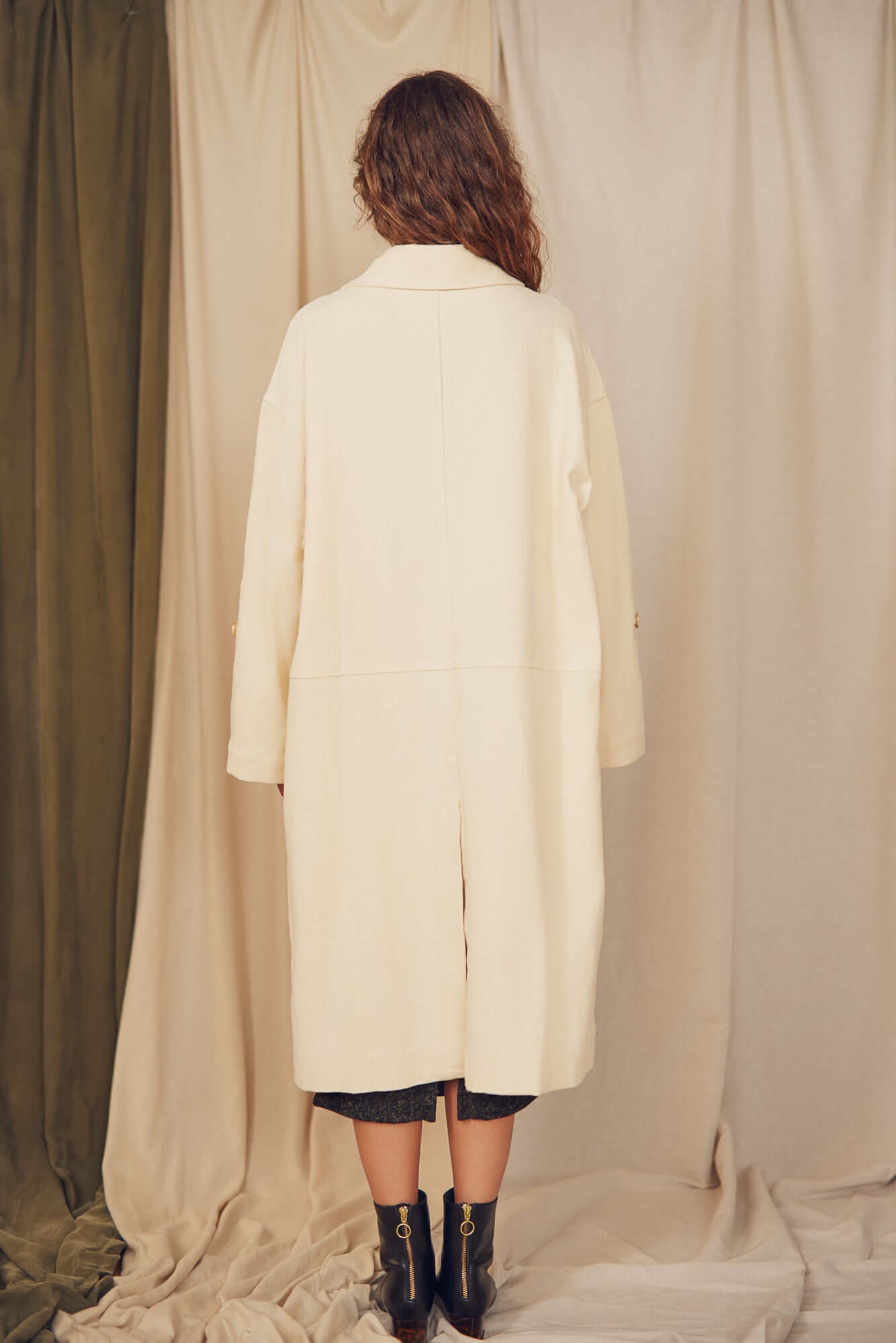 Oat Organic Cotton Long Wide Coat displayed from the back, showcasing its oversized silhouette and eco-friendly design.