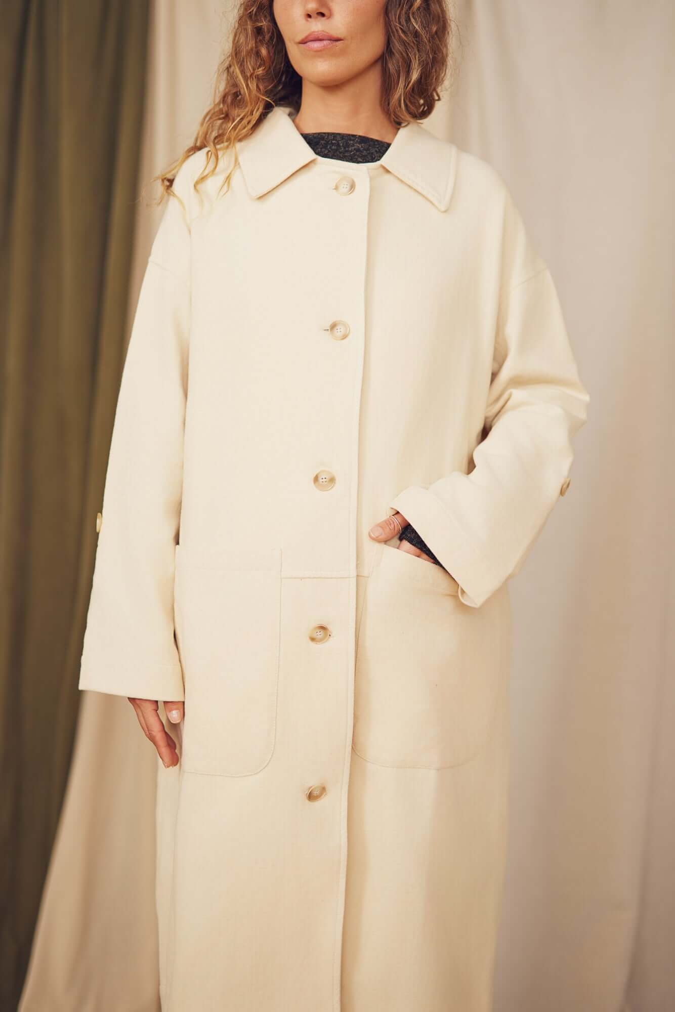 Oat Organic Cotton Long Wide Coat displayed on a model showcasing its oversized silhouette and eco-friendly buttons.