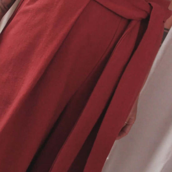 Rust Organic Cotton Wide Trousers showcasing the detachable belt and voluminous silhouette.