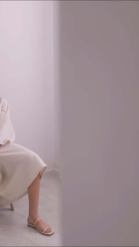 Model wearing the ECRU WAFFLE CROP JACKET, showcasing its lightweight and stylish design.