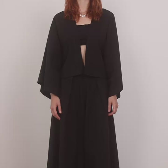 Model wearing Organic Cotton Kimono Jacket in Black paired with wide culottes, showcasing a relaxed silhouette.