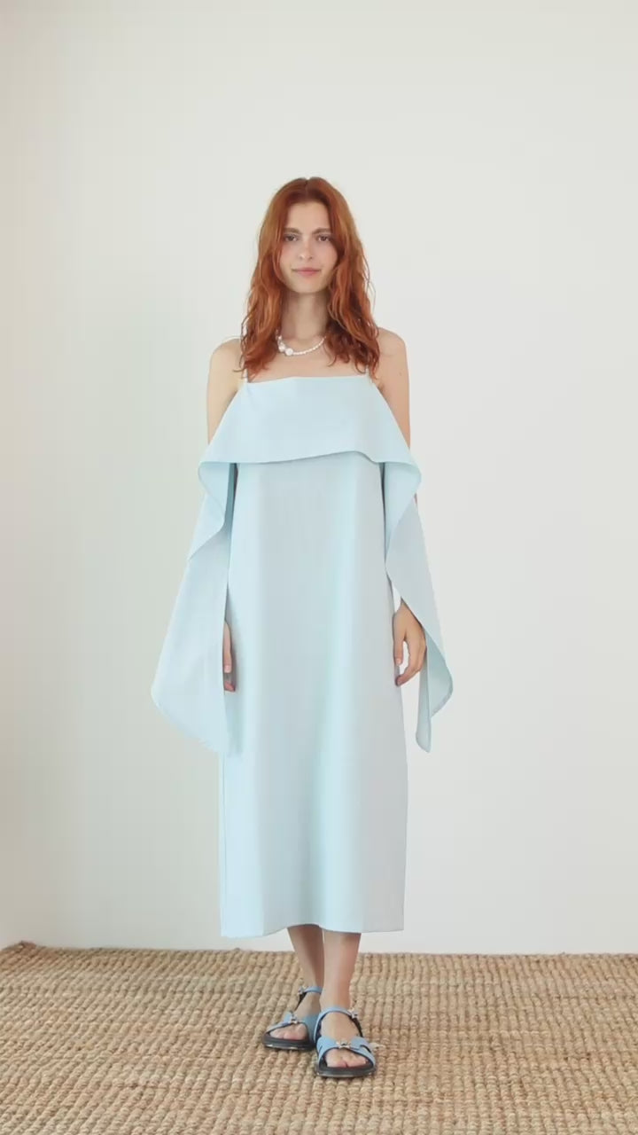 Organic Cotton Sun Dress with Front Frill in Pale Blue worn by a model, showcasing a relaxed daytime silhouette.