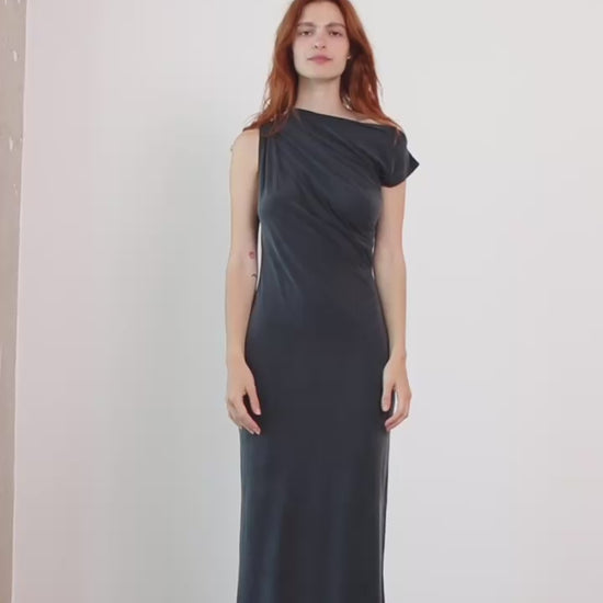 Model wearing Drape Cupro Midi Dress in Slate Black, showcasing draped neckline and fluid silhouette.