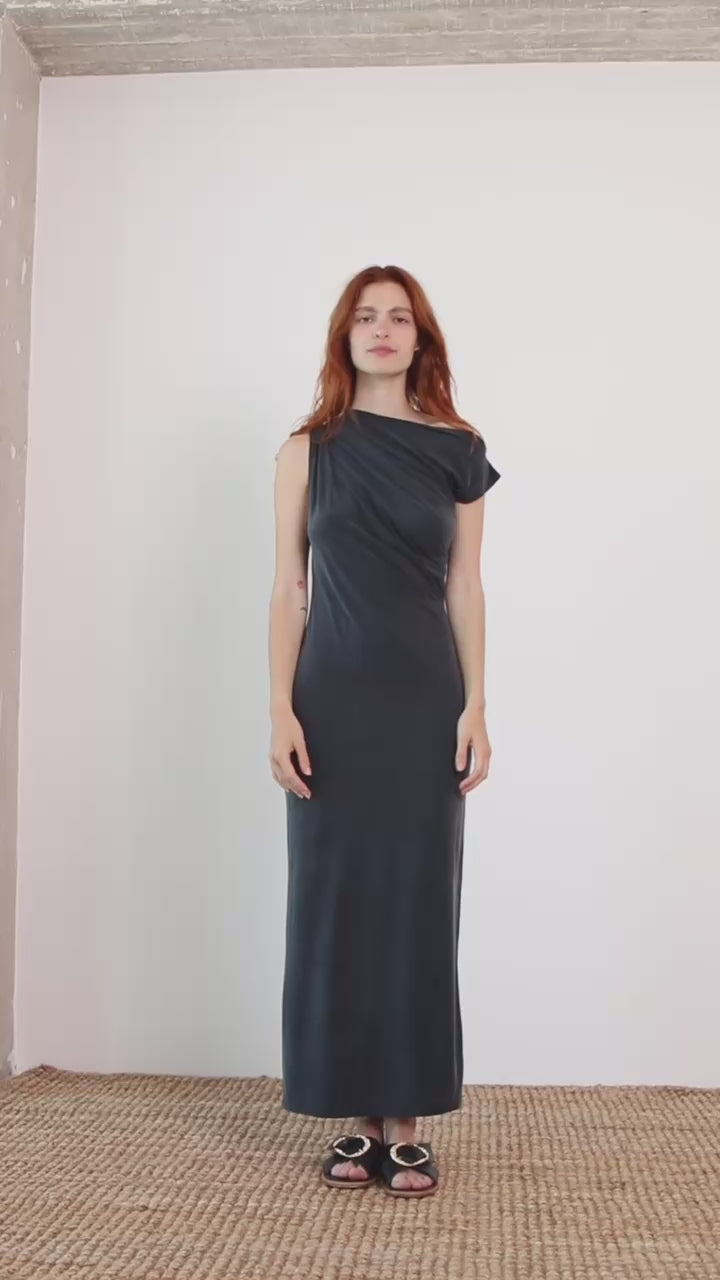 Model wearing Drape Cupro Midi Dress in Slate Black, showcasing draped neckline and fluid silhouette.