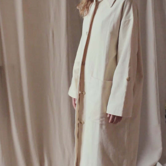 Oat Organic Cotton Long Wide Coat displayed on model against neutral backdrop, showcasing elegant oversized fit.